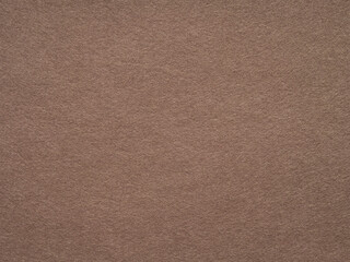 A textured expanse of warm earthy tones evokes a sense of organic simplicity and tactile comfort.