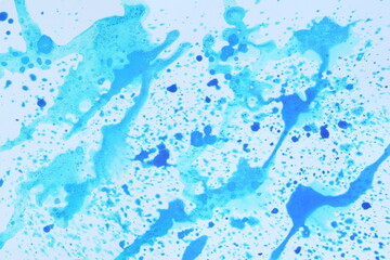 Abstract pattern drawn with blue paint on white paper background. Graphic resource.