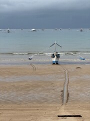 Solitude at Sea: A Fishing Boat Awaits the Storm