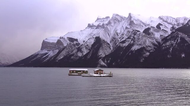 Quiet Lake Minnewanka with floating docking station Alberta, Canada