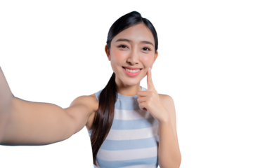 A cute young Asian woman smiling and gently poking her cheek with her finger while taking a selfie.on png 
