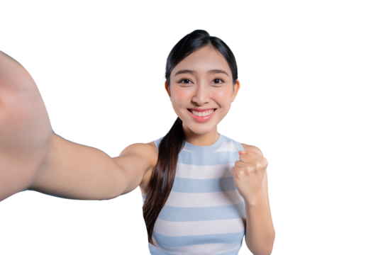 An excited young Asian woman taking a selfie while making a fist pump gesture to celebrate her success or achievement.on png 
