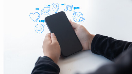 Hand holding smartphone with floating social media icons, representing digital communication, mobile networking, online interaction, messaging, and content sharing.