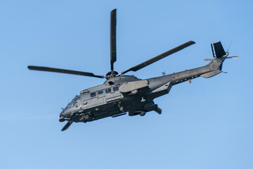 Black painted modern military transport helicopter in Hungary