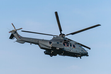 Black painted modern military transport helicopter in Hungary
