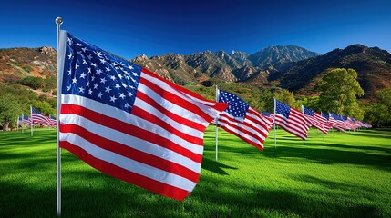 American Flags Waving on Green Grass with Mountain Backdrop