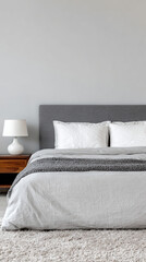 Modern bedroom with gray bedding and white pillows