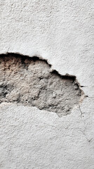 Peeling wall surface with rough texture and visible damage