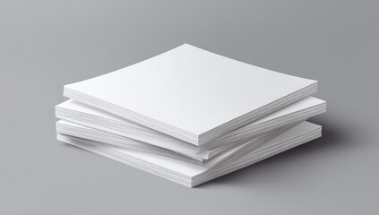 Stack of blank white magazines on a gray surface