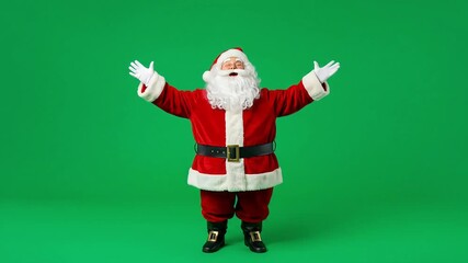 Santa in red suit white gloves wide stance on a green screen backdrop