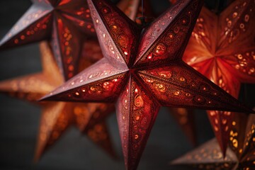 Burnished red star patterns create a vibrant visual display in a dark setting suitable for festive occasions or decor