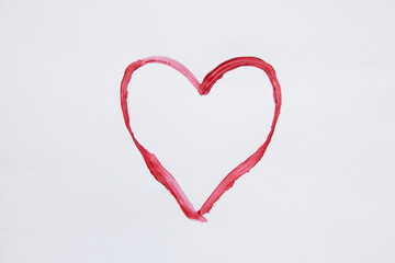 Red watercolor outline heart hand drawn on white background as a symbol of love, valentine