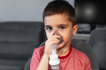 Little Boy Using a Nebulizer at Home