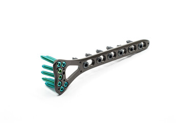 A Surgical Distal Radius Plate with screw on a white background. A plate is used to fix a fractured a Radius bone joint orthopedic.