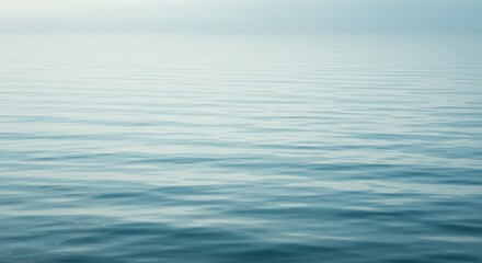 Naklejka premium Calm Water Surface with Gentle Ripples and Horizon