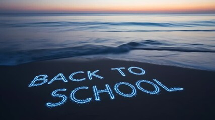 Back to School message on beach sand at sunset. Calm waves, dreamy sky, educational concept, holiday break end, summer closing, beginning class, returning lessons themes.