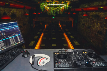 DJ desk and equipment in a nightclub