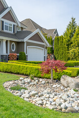 arage door in luxury house with nice landscape in Spring in Vancouver, Canada, North America. Day time on May 2025.