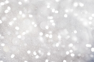 Shiny silver background with sparkling glitter, bokeh effect