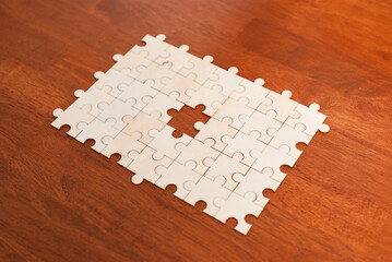 Puzzle piece discovery home table still life cozy environment close-up attention to detail