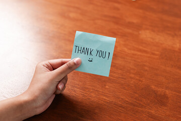 Handwritten thank you note home office photo cozy environment close-up viewpoint gratitude concept