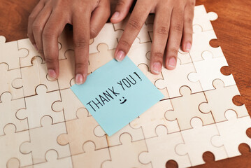 Gratitude expressed on puzzle home office photo indoor setting close-up appreciation concept