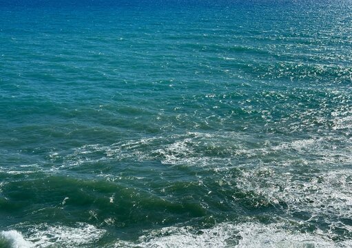 Blue sea waves shiny surface