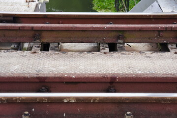 A section of a railway track, specifically showing the rails, sleepers, and ballast