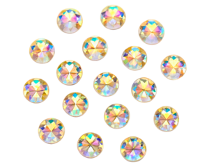 Scattered iridescent faceted rhinestones for craft and decoration on a transparent background