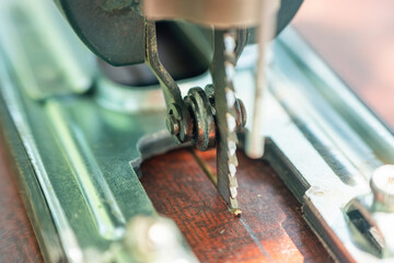 A carpenter cuts a board with an electric jigsaw