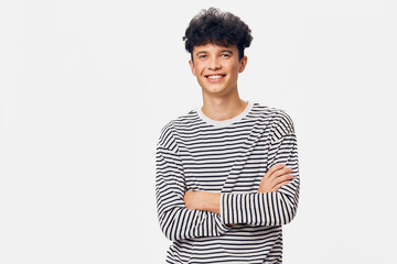 smiling young man in striped shirt with crossed arms, casual confident portrait, isolated white...