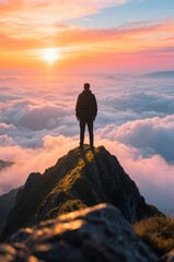 Man on Mountain Peak Above Clouds at Sunset