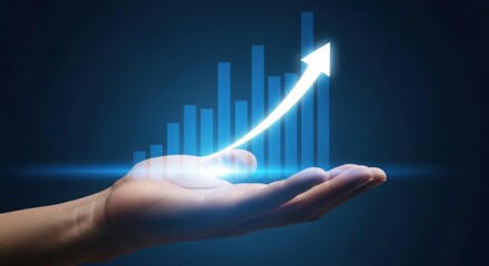 Hand holding glowing upward arrow and financial growth chart