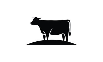 Black silhouette of a cow standing on a small hill against a white background