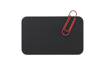 Red paperclip holding dark card isolated on transparent background