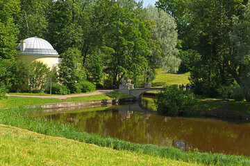 Centaur Bridge over Slavyanka river and Cold Bath Pavilion in Pavlovsky Park, Pavlovsk, suburb of Saint Petersburg, Russia