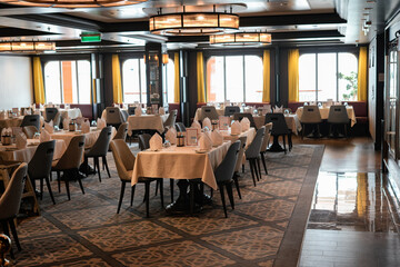 elegant dining room with natural light and arranged tables