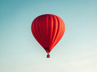 Naklejka premium Red Hot Air Balloon Ascending in a Clear Blue Sky