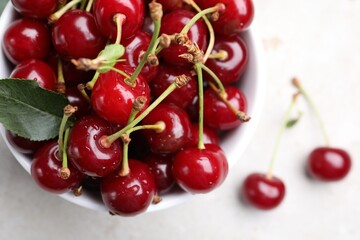 Wet ripe cherries on light table, closeup