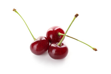 Three fresh ripe cherries isolated on white