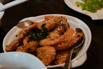 Deliciously Cooked Shrimp in White Plate Garnished With Fresh Herbs