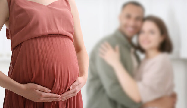 Surrogate mother and intended parents indoors, selective focus - Powered by Adobe