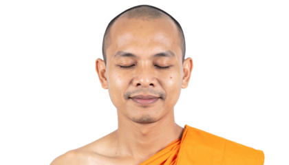 A meditating Buddhist monk in orange robes, serene expression