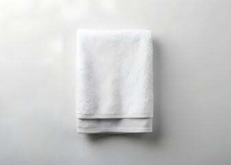White Folded Terrycloth Towel on White Background