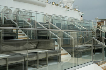 Obraz premium luxurious outdoor deck seating on a cruise ship with modern design