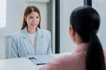 Young professional business woman smiling at camera with digital tablet in modern luxury office workspace, showcasing confidence and professionalism in comfortable productive environment with copy spa