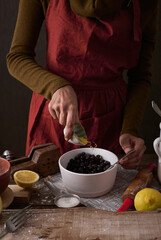 Female chef making Blueberry Galette dessert - recipe image. Berry pie or French Galette