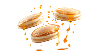 Golden pancakes drizzled with honey, isolated on a white background — a sweet breakfast
