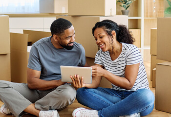 Portrait of a young couple unpacking, moving in and relocation to a new apartment, happy young...