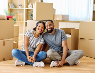 Portrait of a young couple unpacking, moving in and relocation to a new apartment, happy young...